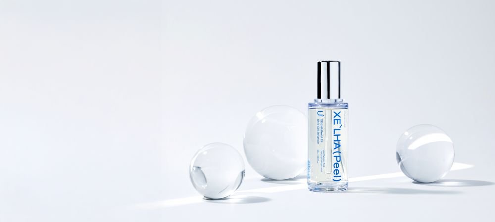 XE'LHA Peel bottle with glass spheres